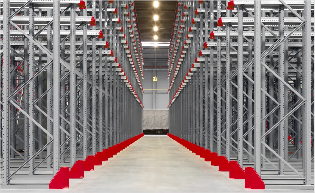 Drive-through racking system with access from both sides for FIFO warehouse storage